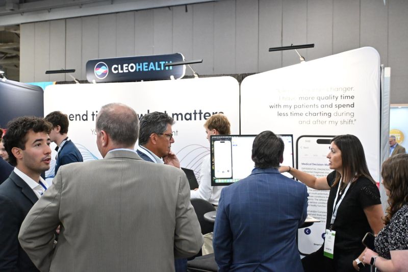 Cleo Health team at conference booth demo